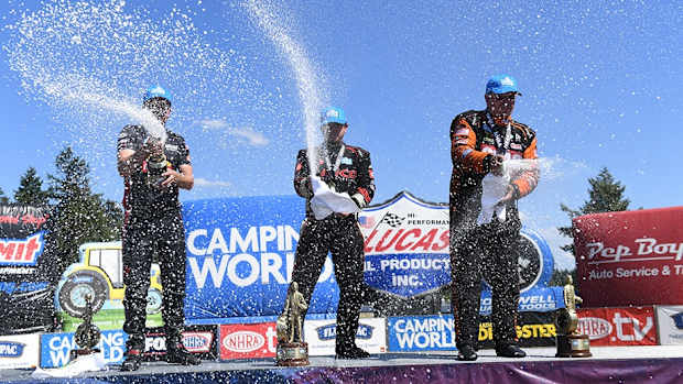 Sunday's NHRA winners at Seattle celebrate (from left): Gaige Herrera (Pro Stock Motorcycle), Steve Torrence (Top Fuel) and Tim  Wilkerson (Funny Car). Photo courtesy NHRA.